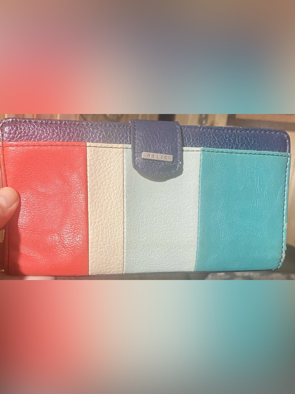 Relic by Fossil wallet a colorful striped leather design with a snap tab closure